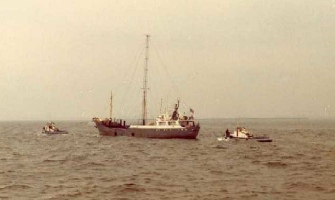 Magda maria being towed into port by police